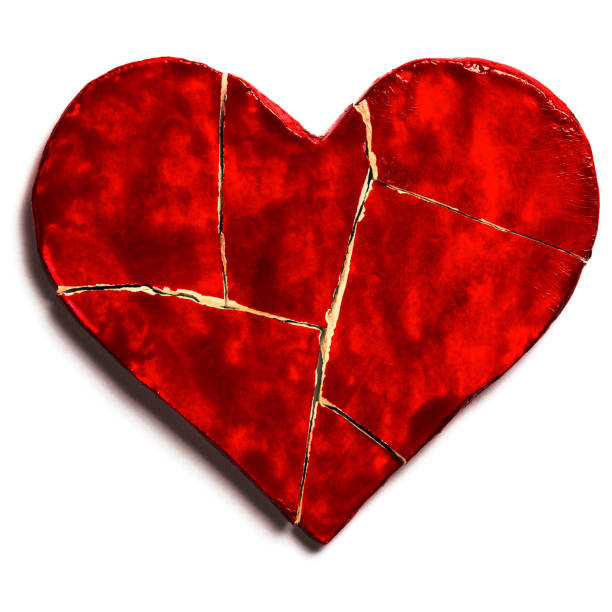 istock Red broken heart isolated on white background. Cut out 1126476043