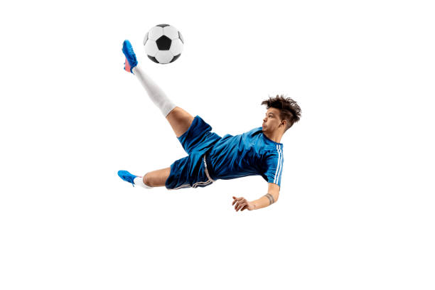 istock Young boy with soccer ball doing flying kick 1126476044