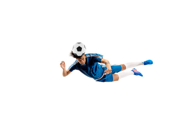 istock Young boy with soccer ball doing flying kick 1126476049