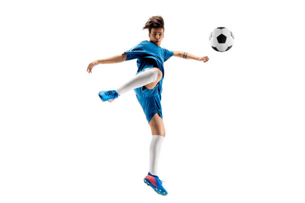 istock Young boy with soccer ball doing flying kick 1126476072