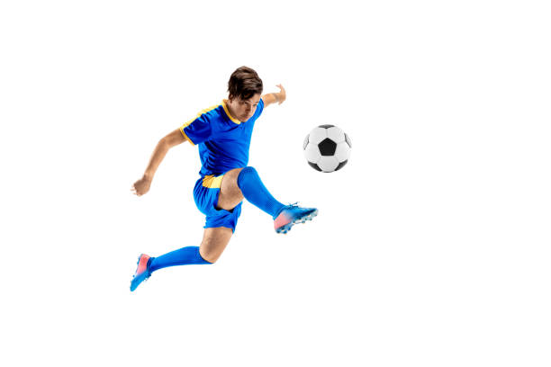 istock Young boy with soccer ball doing flying kick 1126476099
