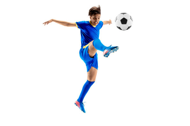 istock Young boy with soccer ball doing flying kick 1126476100