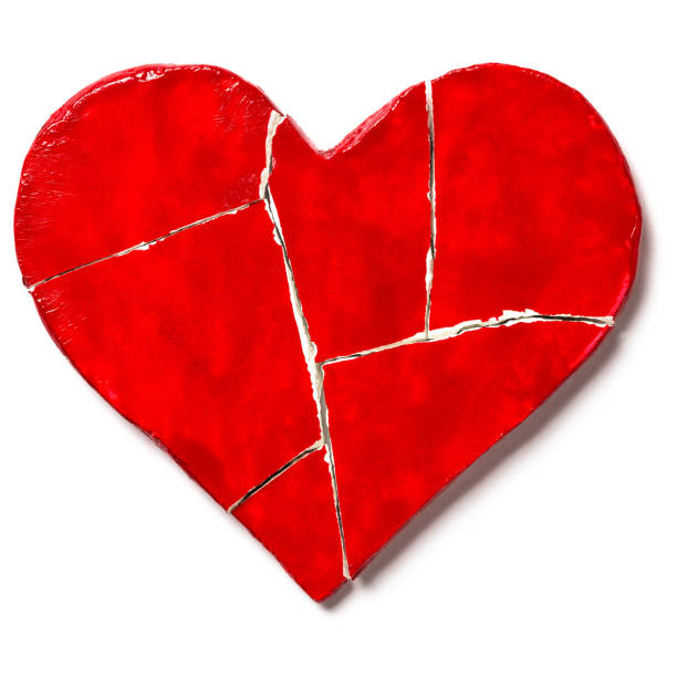 istock Red broken heart isolated on white background. Cut out 1126476103