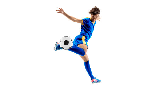 istock Young boy with soccer ball doing flying kick 1126476108
