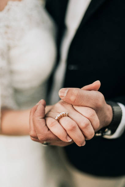 istock Bride and groom dancing, close-up, holding hand 1126478854