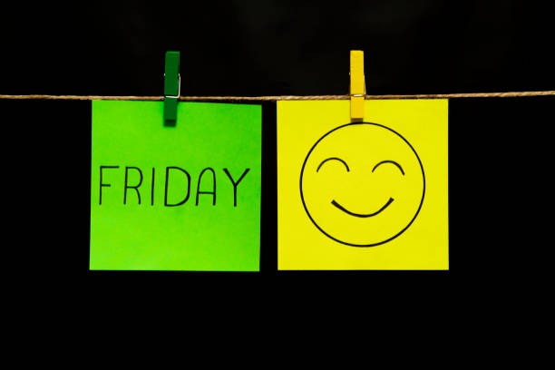 istock Copy space. Two multicolored stickers. On left a sheet inscription friday. On the right sheet face with smile and good nature. Emotion. 1126479261