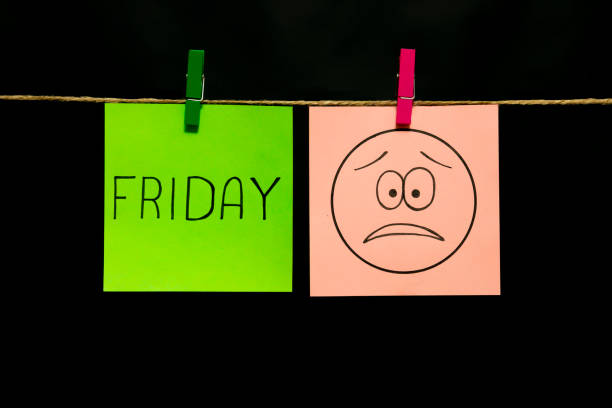 istock Copy space. Two multicolored stickers. On left a sheet inscription friday. On the right white page an expression of sadness and frustration. 1126479508