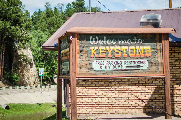 A sign welcomes visitors to Keystone, SD. Keystone is a popular place for tourists to eat and shop en route to Mount Rushmore Keystone, South Dakota - July 13, 2018: A sign welcomes visitors to Keystone, SD. Keystone is a popular place for tourists to eat and shop en route to Mount Rushmore keystone south dakota photos stock pictures, royalty-free photos & images