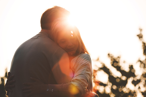 Mid adult couple outdoors at sunny day