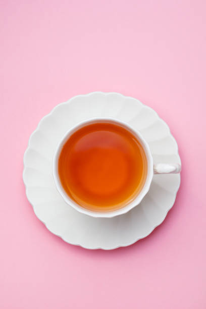 istock Tea in white cup on pink background. Copy space. Top view. 1126486212