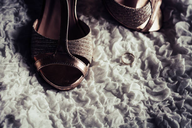 istock Women's sandals, golden ring, and gift 1126487718