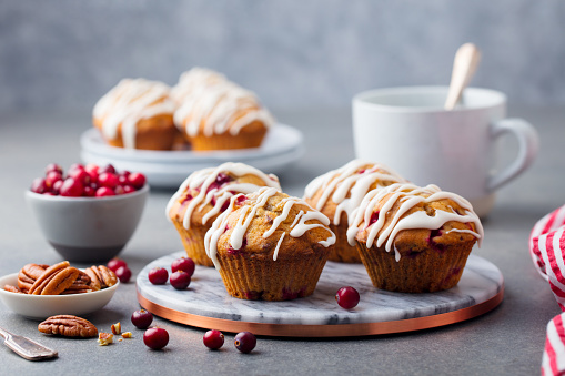 Muffins, cakes with cranberry and pecan nuts. Christmas decoration