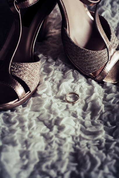 istock Women's sandals, golden ring, and gift 1126487944