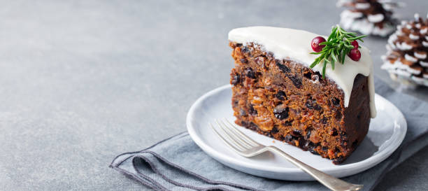 Christmas fruit cake, pudding on white plate. Copy space. stock photo