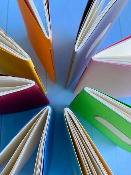 istock Circle of workbooks from above 1126491248