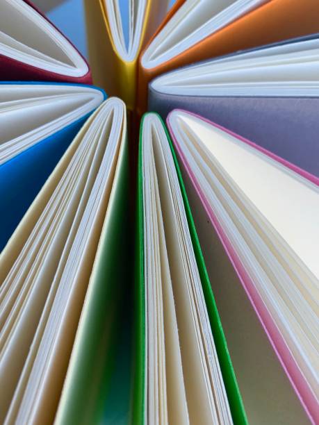 istock Circle of workbooks from above 1126491279