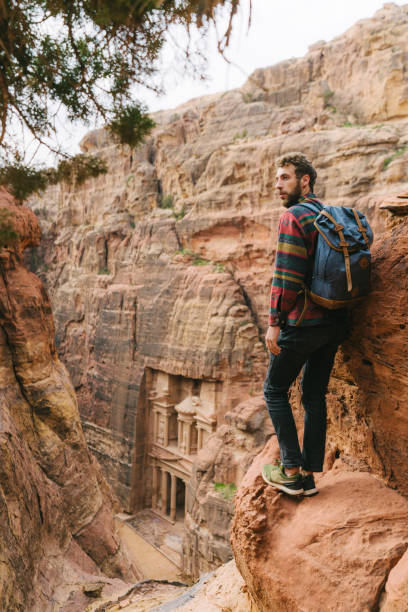 istock Man looking at Al-Khazneh in Petra 1126492023