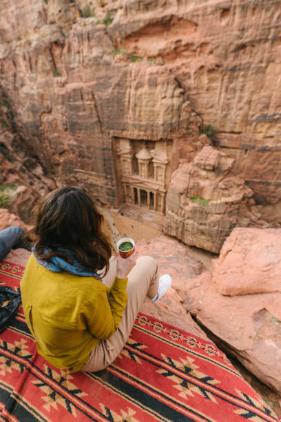 istock Woman looking at Al-Khazneh in Petra 1126492876
