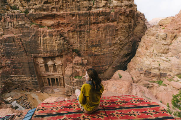 istock Woman looking at Al-Khazneh in Petra 1126492982
