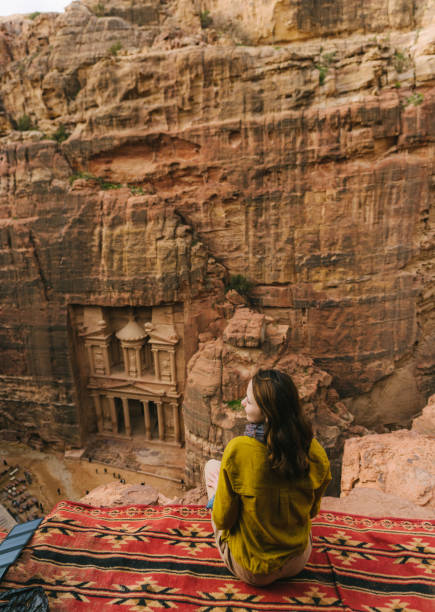 istock Woman looking at Al-Khazneh in Petra 1126492999