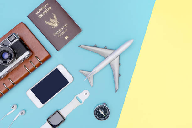 istock travel objects and accessories on blue yellow background with passport camera and plane 1126493062
