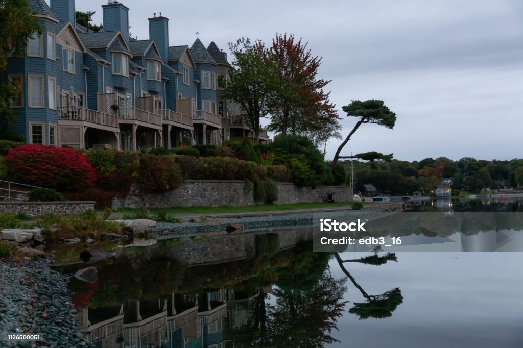 Halifax Armdale, Halifax, Nova Scotia, Canada - October 7, 2018: Residential homes by the water during a cloudy sunrise. Atlantic Ocean Stock Photo