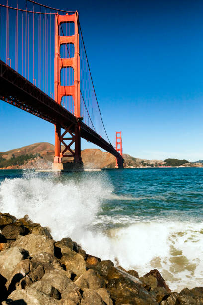 The Golden Gate Bridge w the waves stock photo