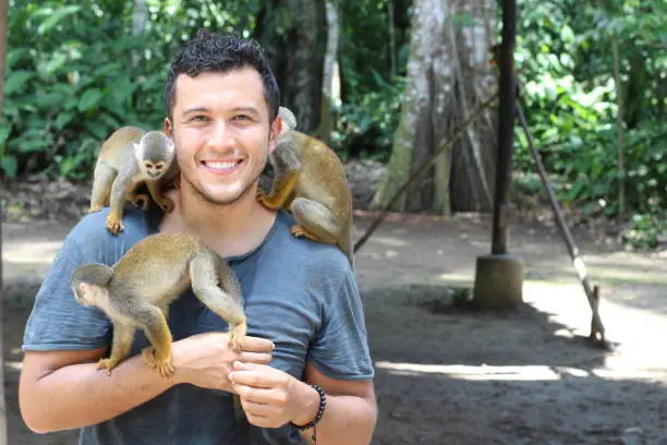 Photo of Titi monkeys and a trainer