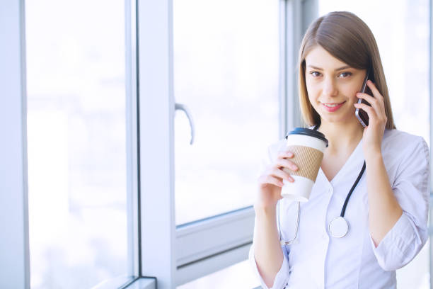istock Clinic. Cheerful Doctor working at her office 1126505547