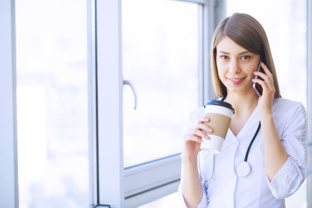 istock Clinic. Cheerful Doctor working at her office 1126505557