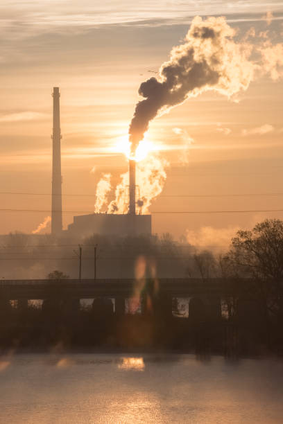 istock Rising sun over thermal power plant 1126506099