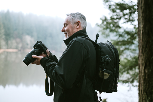 Mature Adult Male Photographer On Nature Hike