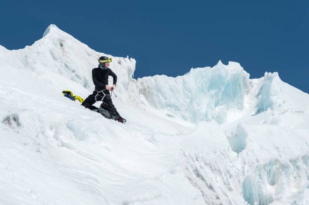 istock Mountain guide candidate training ice axe and rope skills on a glacier in the North Caucasus 1126509646