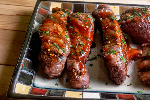 istock Beef Boneless and Bone-in Ribs in Barbecue Sauce on a Rustic Platter 1126510993