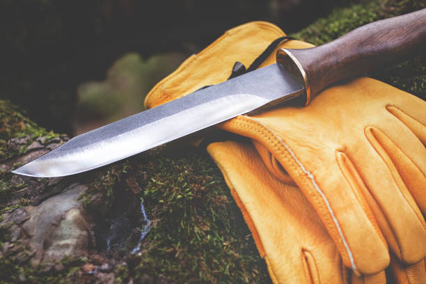 istock Hunting knife and leather gloves 1126513367