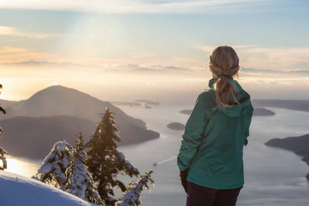 istock Girl on top of a mountain 1126513879