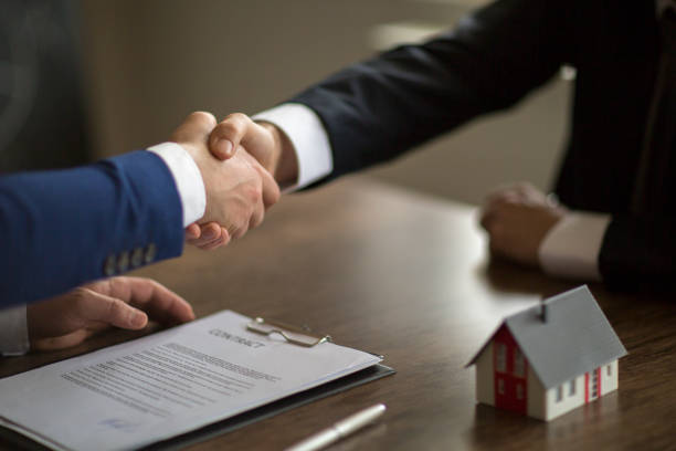 istock Making real estate deal, handshake with agent 1126517381