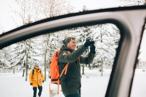 istock Young hiker photographing winter landscape 1126518507