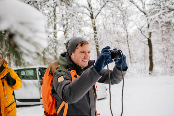 istock Hiker photographing winter landscape 1126518537