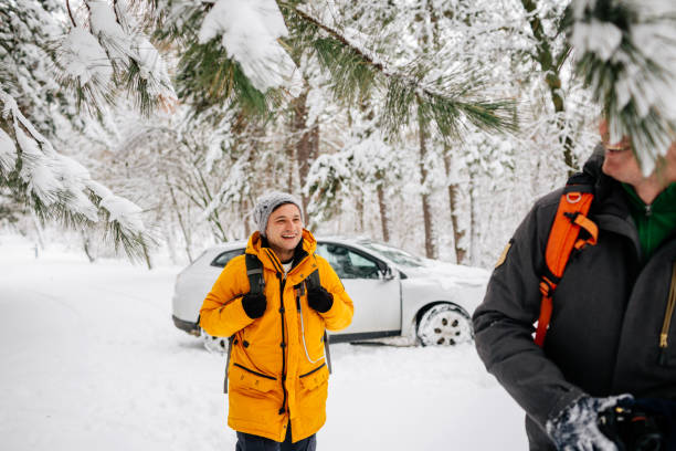 Smiling hikers on a winter road trip