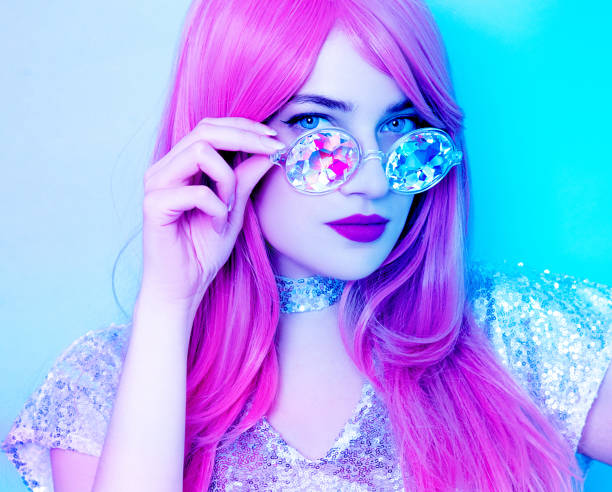 istock Young woman in vibrant lights 1126522410