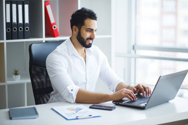 istock Handsome Businessman Working on Laptop at His Office 1126522782