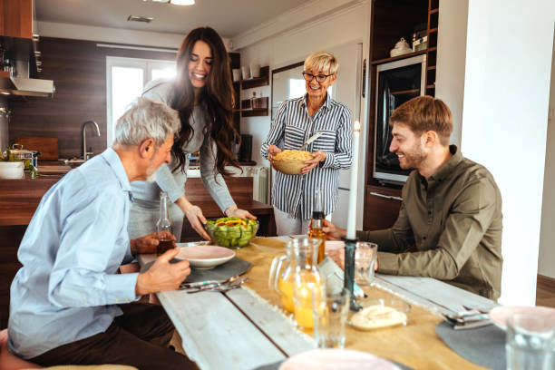 istock Enjoying a lunchtime with family 1126528103