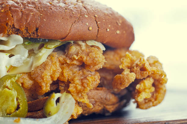 istock Burger with dark bread on wood Board 1126534824
