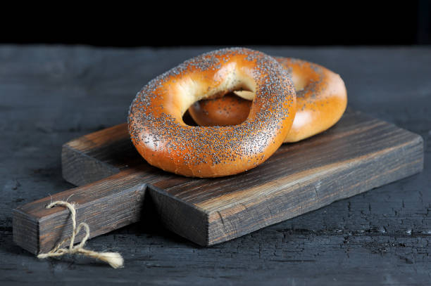 istock bagels with poppy seeds on a wooden Board 1126535890
