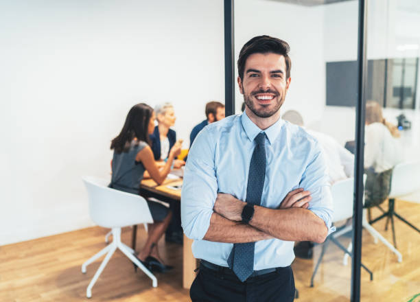 istock Businessman with his team behind 1126535991