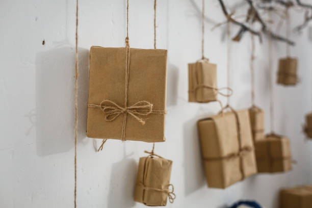 istock Christmas gift boxes in front of wall with copy space 1126540429