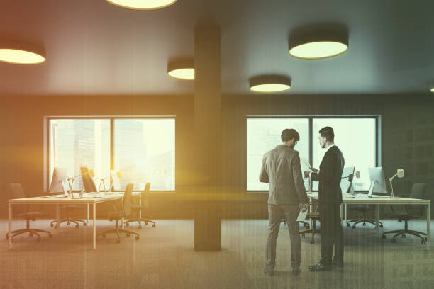 istock Brown industrial style office side view, men 1126543434