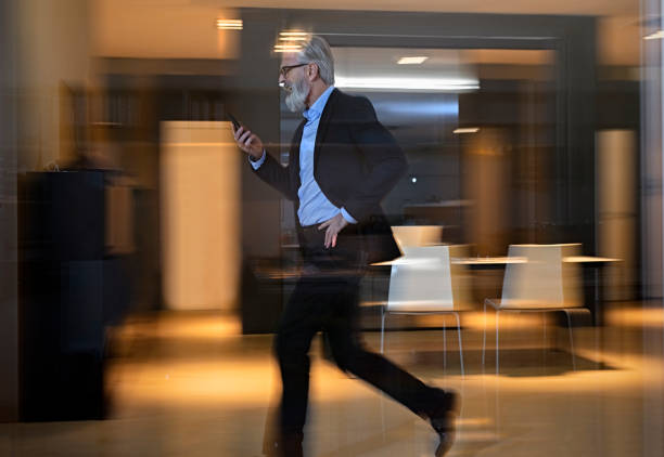 istock Businessman  walking along office  walkway 1126545725