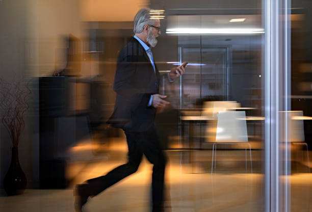 istock Businessman  walking along office  walkway 1126546440